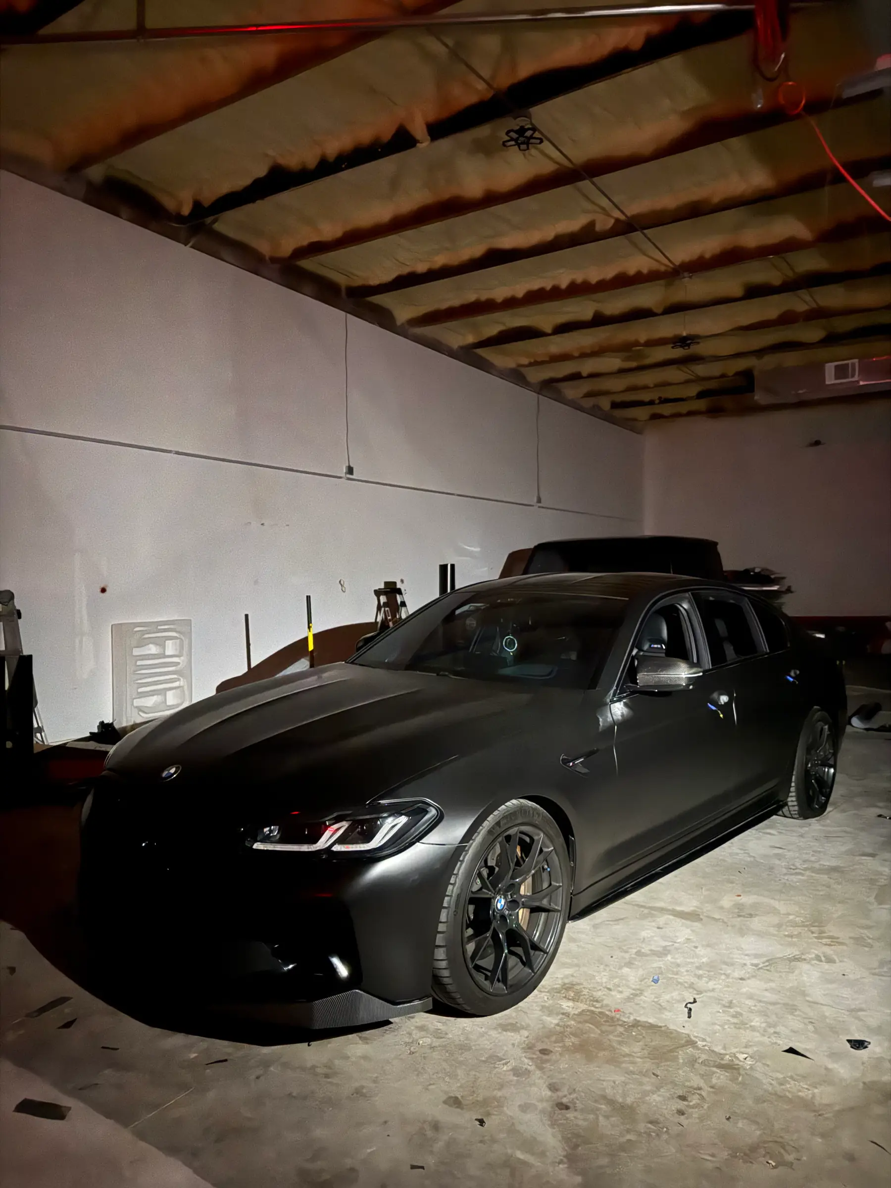 BMW M5 Comp: Satin Black wrap, front three-quarter