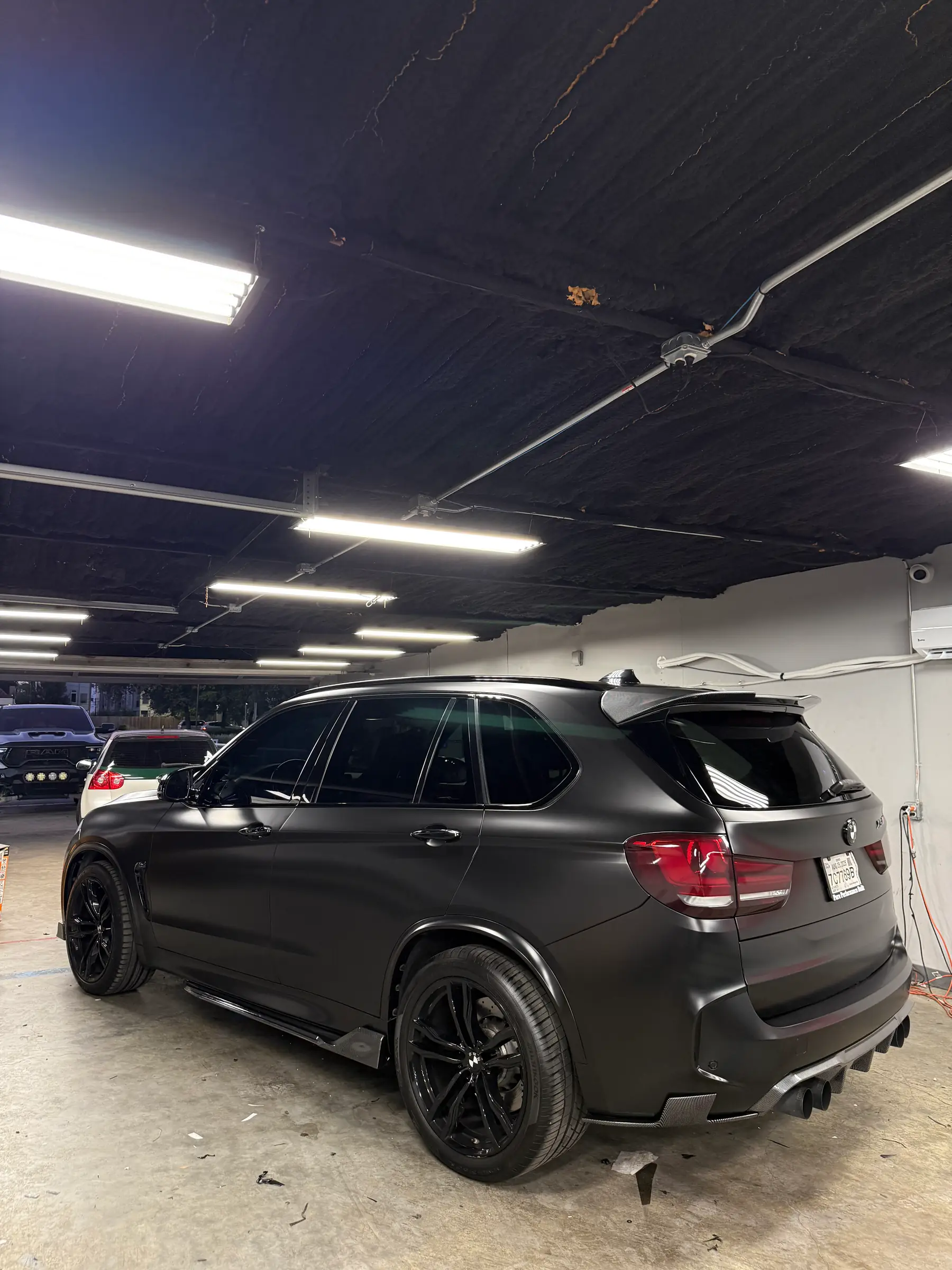 BMW X5 M: Matte Black wrap, rear three-quarter