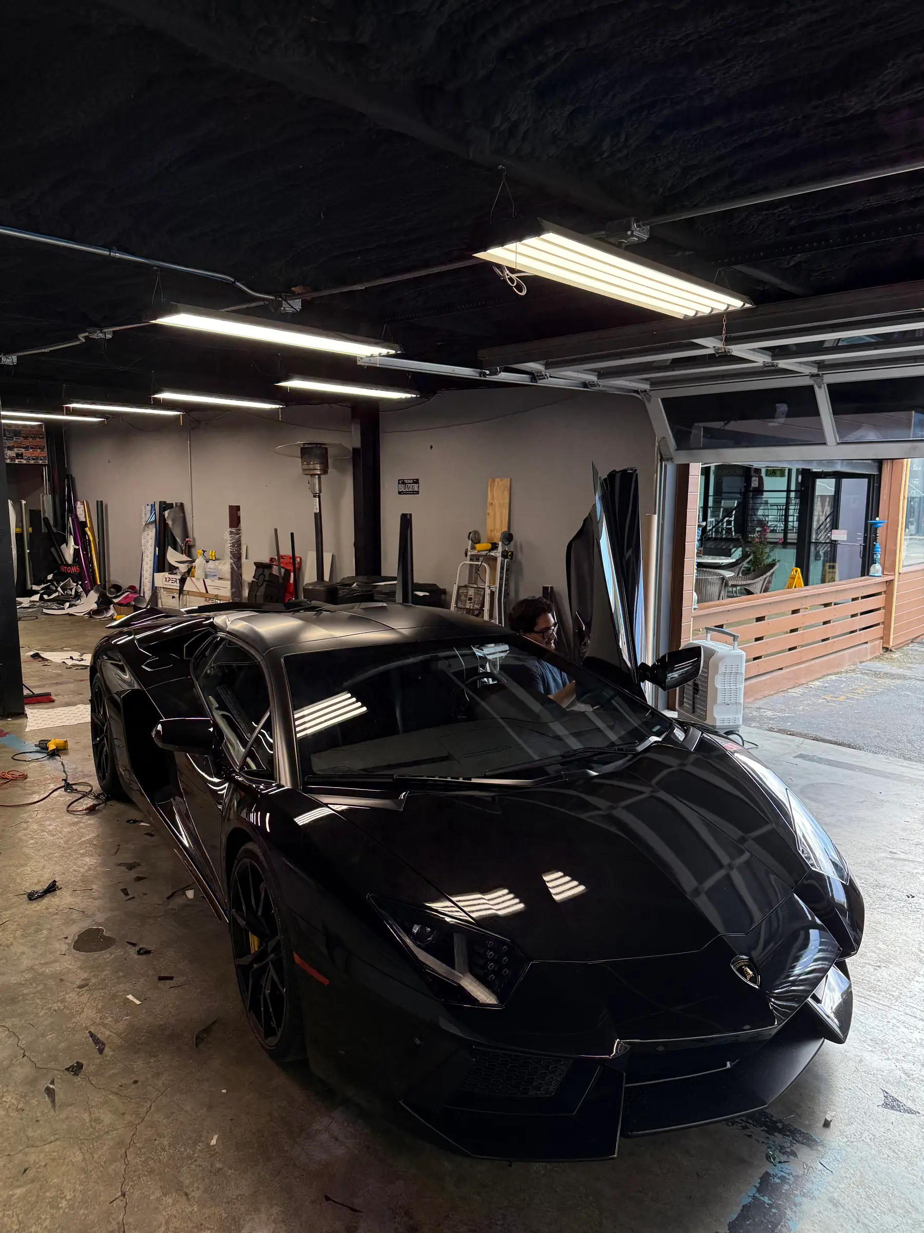 Lamborghini Aventador: Nero Nemesis wrap, front three-quarter
