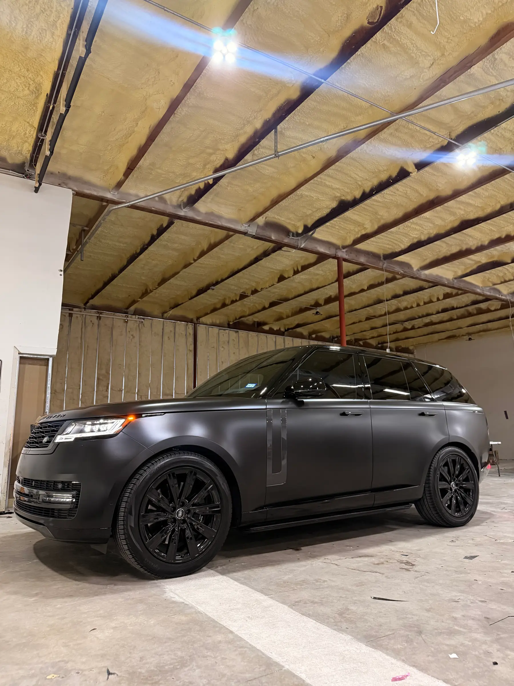 Range Rover: Matte Grey wrap, front three-quarter