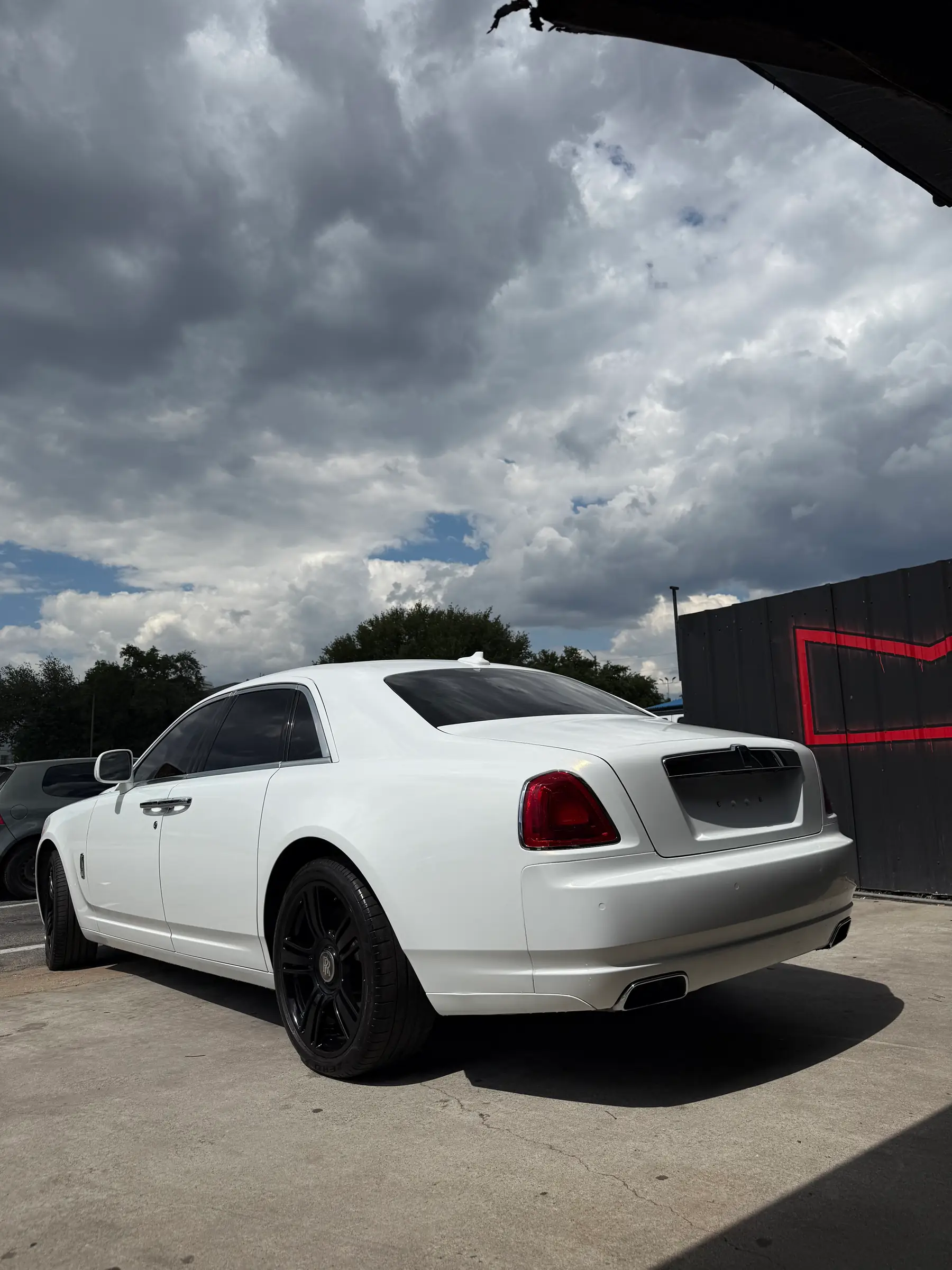 Rolls-Royce Ghost: Pearl White wrap, rear three-quarter