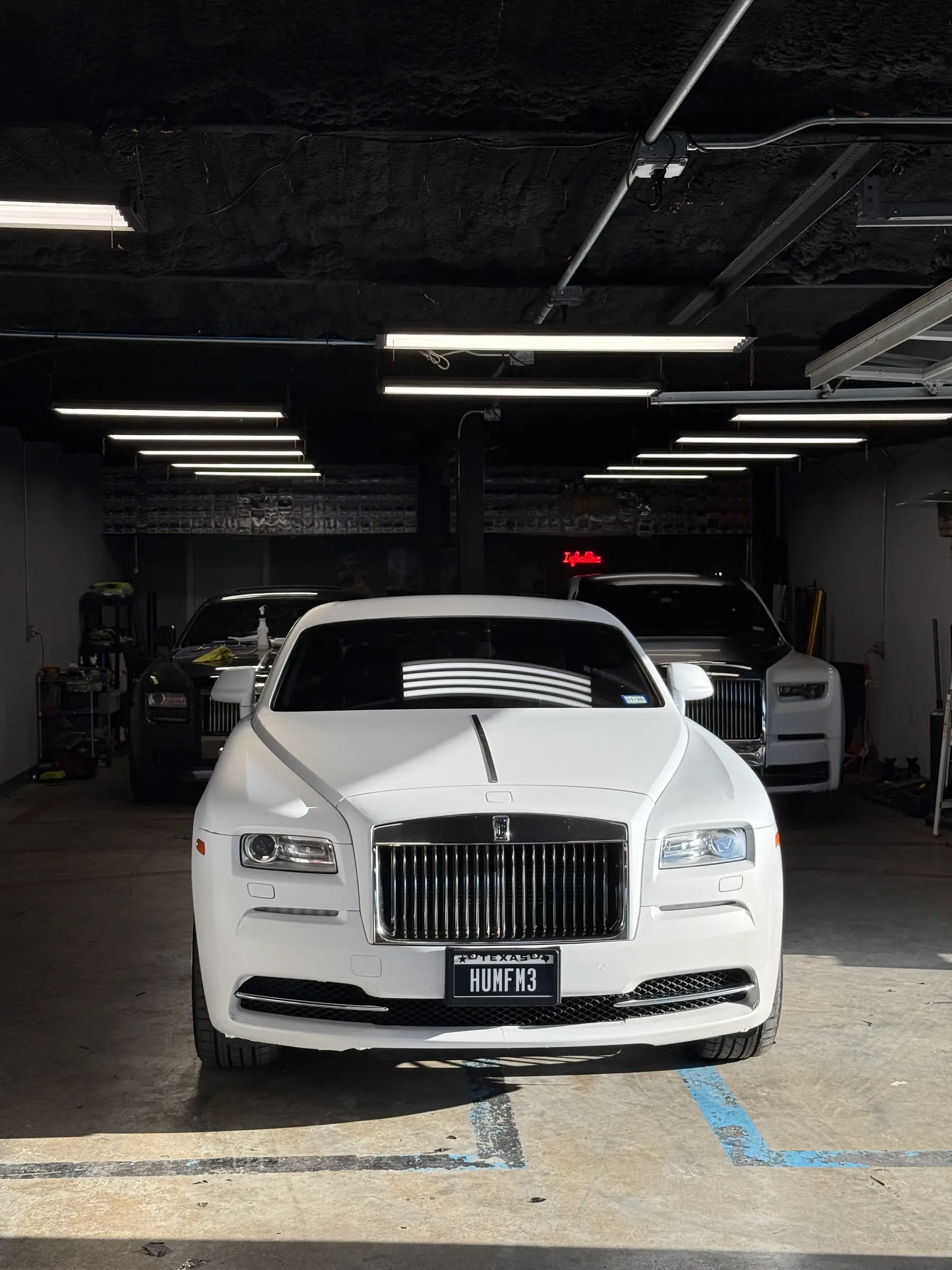 Rolls-Royce Wraith: Pearl White wrap, front three-quarter